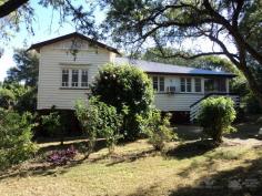  1 Albert Street Boonah QLD 4310 $285,000 This Queenslander situated only 3 minute drive to local schools and shops features - Timber kitchen with lots of cupboard space - Combined lounge and dining area - 3 bedrooms + study - Ensuite to main bedroom - Front enclosed sunroom - Polished floors - Double carport - Partially fenced 984sqm block - Solar hot water 