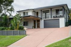  6 Murray Street Eleebana NSW 2282 $655,000 - $695,000 This sensational family home with northerly aspect has been totally refurbished with all the modern comforts that you deserve. If you think it looks great on the outside, you will be blown away on what's inside. From the formal entry right through to the extra-large alfresco entertainment area nothing has been spared. Floating timber floors and air-conditioned comfort in the living areas, soft quality carpets in the three bedrooms and the multi-purposed room downstairs plus modern shutters and venetians.  Well there are kitchens and then there are kitchens. This one steals the show with a generous island bench, stainless steel appliances, soft close cupboards and draws and is the focal point of the home. It has easy access to the extra-large alfresco for fun with friends and a casual dining for family dinners. If that's not enough the vogue bathroom looks like its straight out of a glossy magazine and will blow your socks off.  Nestled on a near level kid-safe block it's the perfect spot to raise a family. Great garaging for three cars or even that boat you've always wanted as its only 600m to the boat ramp.  