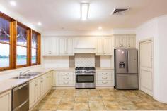  13 Summer Drive Buronga NSW 2739 $449,500 - $493,000 Crafted from recycled red brick and set on a 1216sqm block in a quiet enclave of Buronga, this character home is perfect for a growing family. With a large backyard, sprawling floorplan and outdoor living space, this is a home perfectly crafted those who need room to move. There are four bedrooms, two with built-in closets and the master suite with a walk-in robe and ensuite with twin vanities. There are plenty of living spaces to enjoy including open-plan dining and family room and a living room at the rear of the floorplan. A study is located off the main living space, perfect for those who work from home. When it's time to cater for loved ones, the well-equipped kitchen will impress even the fussiest home chef. Enjoy a 900mm gas cooktop and oven, a large walk-in pantry, breakfast bar and plenty of prep space. Extra features abound and include slow combustion heating, reverse-cycle heating and cooling and a powder room. There is an attached double lock-up garage with additional storage, plus side access to the yard. Step outside to the semi-enclosed alfresco area with a ceiling fan, oven and outdoor toilet for complete convenience and comfort. There's a great-sized backyard for the kids, plus low maintenance gardens. FEATURES: Air Conditioning Built-In Wardrobes Fireplace(S) Formal Lounge Garden Secure Parking Study. 