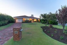  11 Tropical Gardens Ballajura WA 6066 $575,000 Team Reid is excited to present to you this stunning modern family home perched atop an elevated cul de sac in the Lakes Estate. Be warned, once you come to see this fantastic property, you won’t want to leave without registering your bid!  Featuring a breathtaking renovated kitchen that boasts a designer Falcon oven and stove as well as more storage than you could possibly ever need, you’ll have the perfect oasis to cook up a storm or prepare a feast for all your friends and family. Now you’re not just limited to the kitchen when it comes to the cooking and festivities. You can entertain all year round under the large pitched patio entertaining area that includes an outdoor kitchen with a built in BBQ and range hood, gas hot plate, sink and under bench storage. You can also chill out and relax in the heated spa while you watch the kids run amok in the spacious bore reticulated yard. The beauty of this home lies not only within its fantastic entertaining areas and added extras but also with the smart floor plan. A well thought out bedroom layout with semi ensuite between the master suite and bedroom two allows for the perfect nursery setup or bedroom for young kids, while the three rear bedrooms are great for the older kids.  Not only does this gorgeous family home have the wow factor, it boasts the perfect combination of style, comfort and modern charm. If that’s not enough, the convenient Lakes Estate location allows for easy access to shops, schools, parks and everything else Ballajura has to offer.  Call us today to arrange your viewing so as to not miss out on this hot property!  •5 Bedrooms/2 Bathrooms (1 semi ensuite)  •Zoned ducted reverse cycle air conditioning •Alarm security system •Smart sound system – enjoy music in 6 separate zones inside & out •Light & bright formal lounge & dining •Open plan kitchen, meals & step down family  •Stunning renovated kitchen featuring designer Falcon oven •More kitchen storage space than you could possibly need •Spacious pitched patio entertaining with ceiling fans •Outdoor kitchen & storage with BBQ, gas stove and sink •Large back yard with heated spa and 3 garden sheds •Bore reticulated gardens •Single remote door garage + ample parking space on driveway •Quiet Lakes Estate cul de sac location •Sought after Ballajura Primary School catchment area •Just a 6 minute walk to the closest bus stop (google maps) 