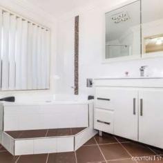  31 Callagher St, Mount Druitt NSW 2770 $950,000 Are you looking for a home where you can just sit back, relax and enjoy life? Look no further Sid Elias from Ray White Colyton is thrilled to present this sensational Steel Frame 4-bedroom, twin garage family home in the booming suburb of Mount Druitt. Recently renovated and situated on a massive 1011 square metre block, this home is ideal for a family who wants to live in comfort and luxury. Upon entering this home, you'll immediately love the gorgeous porcelain tiles, downlights and three-zone ducted air conditioning. The first of two loungerooms is located at the front and is an ideal spot to kick back and enjoy a good film. Also at the front of the house is the large master bedroom, which features a walk-through robe and gorgeous ensuite. Continuing down the hall, the house opens up and you'll discover the large kitchen with its ample cupboard and bench space and large pantry, as well as the spacious dining room. Connecting the dining room is the second lounge, which is ideal for relaxing after a meal. Off the second lounge room, you'll find the three remaining spacious bedrooms, two of which feature built-in-robes, as well as the home office. The stunning main bathroom is conveniently located between two bedrooms and features a step-up spa, floor to ceiling tiles and a separate toilet. Finally, at the back of the house, you'll be thrilled to discover the large, sunny games room which will take your entertaining to the next level. Out the back, the tiled alfresco dining area is the perfect place for hosting barbeques and features twin heaters, fans and a TV which means it's ideal for use all-year-round. The back yard is huge and features neatly manicured lawns and gardens, as well as a sensational in-ground saltwater pool, which is ready to be fitted with solar heating and is the perfect way to cool down during the summer. 