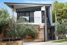  16 Douglas Street Clovelly NSW 2031 A striking sculptural facade, beautiful palette of materials and artfully conceived interiors create a bold statement in this custom-built Clovelly home. The freestanding home balances cutting-edge design with heritage materials to anchor the home into its site and give the interiors a rich and engaging narrative. A 7m high 'pixelated' brick wall inspired by architect John Wardell creates a dramatic entry while expansive interiors are wrapped in glass with linear and circular skylights creating a dynamic interplay of light and space. The social heart of the home features a bespoke Calacatta marble kitchen opening to landscaped gardens complete with an outdoor kitchen and heated pool and spa. The home's innovative design is expressed as a graceful, abstract sculpture creating a one-of-a-kind residence that has won awards for its craftsmanship. * Double height entry, custom pivot door * 4 double bedrooms plus a fitted study * Master suite with cantilevered balcony * Bespoke joinery and extensive storage * 100 year old reclaimed Ironbark beams * Hand laid French Chevron parquet floors * Off form concrete, highlight windows * Marble island kitchen, butler's pantry  * Miele appliances, induction cooktop  * Landscaped internal courtyard garden  * Seamless flow to an alfresco lounge  * Fully integrated outdoor kitchen/bbq  * Glass-framed heated pool and spa * 3 luxurious marble-finished bathrooms * Lusso Stone freestanding round bath * Gessi tapware, rainfall shower heads * Underfloor heating, multi-zoned air  * Custom barnyard-style sliding doors  * Dynalite home automation system * Surround sound and ducted vacuum  * Double garaging with internal access  * Winner MBA Best Brick and Block Award * Winner MBA Roofer of the Year Award * Clovelly Public School catchment zone * Walk to village life and a choice of beaches. 