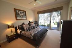  4/6 Berry Street Moama NSW 2731 Our motivated vendors are now selling this immaculately presented property that offers one lucky purchaser arguably one of Moama`s best views in a sought after central location close to Moama Bowling Club and a nice walk to Echuca`s CBD. From the moment you walk through the door you will notice the attention to detail and quality of this property, but the real sealer is when you enter the kitchen/family & dining area, the views oh the views, these are the best around. This property offers the perfect indoor outdoor living options that will be the envy of all your guests while you watch & hear the paddlesteamers go past. The master bedroom complete with walk in robe and ensuite also share similar views to the living area and combined with the ducted heating & cooling throughout and gas log fire you will be comfortable all year round. This property offers so much like double garage with internal access, timber flooring, well appointed kitchen and the list goes on. This is a must see property that will not disappoint. FEATURES: Air Conditioning Built-In Wardrobes Close To Shops Fireplace(S) Garden Polished Timber Floor Secure Parking. 