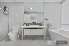  5 BELSAY CHASE CHIRNSIDE PARK VIC 3116 $600,000 - $660,000 Set apart from the rest, this newly developed architecturally designed sanctuary is a spectacular example of contemporary suburban living.  Over two levels and highlighted by a spacious lounge and dining zone, flexible upstairs retreat, and terrific low maintenance Zen courtyard. This picturesque and peaceful property is at the gateway to the Yarra Valley and only a stone's throw from wonderful Chirnside Park attractions including schools such as Oxley College, parks and Chirnside Park Shopping Village which is within only walking distance! Awash in superb natural light and owning superior fittings and fixtures throughout, this generous family haven exudes warmth. Showcasing an enormous rear living zone, with a meals area enjoying exquisite pendant lighting, and access to the easy-care alfresco area through the breezy double doors. The vogue kitchen has shimmering black stone surfaces, an island bench and quality stainless steel gas appliances, while the additional upper level retreat is brilliantly flexible.  The master suite features full-length windows allowing an abundance of natural light as well as a walk-in robe and immaculate ensuite, captivating with a deep freestanding bath tub. The two other bedrooms own robes and a shared balcony and neighbour the pristine, fully tiled central bathroom with a wall-to-wall shower.  Also enjoying a sleek powder room, under stairs storage, ducted heating, evaporative cooling, tinted windows, split system units, LED down lights, low maintenance tiling throughout bottom level, security doors at front and rear, a laundry with access to the remote garage. 