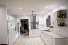  44 Thomas Court Bulgun QLD 4854 $480,000 This home in a rural like setting amongst other small acreages wold ideally suit a family. There are 5 bedrooms, a huge 72,000 litre pool, double garaging and a huge pool side under cover outdoor patio/living area plus an extra 5000 x 10000 under cover space. It appears to be very solidly built out of cement block with no expense spared. The kitchen is spectacular and recently installed and there is a roomy sunken lounge. There are split air-cons all throughout, bay windows and a circular drive way. The colourbond roof is only a few years old. (Undoubtedly this huge quality home would cost several hundreds of thousands of dollars to build today, given the quality and materials used). The property backs on to Wunga Creek and is fully fenced. It is located at Bulgun, a semi rural neighbourhood only 20 mins. from Mission Beach with lush tropical islands and the Great Barrier Reef off shore. Highly Recommended to View this Realistically Priced Gem! FEATURES: Air Conditioning Built-In Wardrobes Garden Pool Secure Parking Terrace/Balcony 
