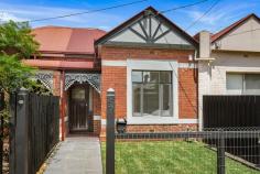  97 Bent Street Northcote VIC 3070 $1,050,000 The classically attractive Edwardian profile of this stunning residence reveals a comprehensively contemporary interior newly finished to absolute precision and perfection (6 star energy rating). Northcote High School-zoned near vibrant High Street, trams, train station and parklands, the plum inner-city position of this exceptional-quality home is invitingly quiet and incredibly convenient. Culminating in a spectacular open-plan zone with soaring highlight windows and double-glazed doors to private entertainers' courtyard, the single-level layout is brilliantly designed with an emphasis on light-filled, easy modern living. Offers two superb bedrooms with fitted BIRs and ceiling fans, study with desk and storage, outstanding Ariston-appointed stone kitchen with walk-in pantry and soft-close storage, spacious living and dining room, sleek and stylish bathroom, full separate laundry with storage, ducted heating, polished hardwood floors and rainwater tank. 