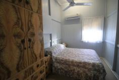  4 Munro St Ayr QLD 4807 $155,000 What a fabulous opportunity to purchase a stylish 2 bedroom highset queenslander on a generous fenced lush 1012m2 block. Available in a highly sought after location in Ayr ever so close to schools, hospitals, doctors and CBD. This property really does present beautifully with its high ceilings timber walls, generous open rooms and neatral tones throughout... Both bedrooms are carpeted, fanned and air conditioned with the availibilty of a breezy l shaped enclosed verandah perfect as that extra sleepout, sitting area to unwind and relax or somewhere for the kids to enjoy... Generous open plan living area for the family with renovated kitchen bragging ample bench, prep and storage space. An extra sitting area to enjoy brekky and cuppa.... Very neat and tidy bathroom amenities bragging both shower and bathtubwith a handy second toilet located on the upstairs back patio... WOW... Underneath is all open with parking available for one... you will also find the laundry facilities as well.... Utilise this great space to sit and relax in the cool with a coldie while admiring the generous lush yard which provides ample room for that desirable colourbond shed... What are you waiting for... Call and arrange your inspection of this delightful home today! 