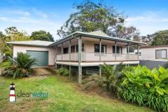  3 Brighton Park Rd Wallaga Lake NSW 2546 $459,000 "Naveen" - Situated in a quiet street at Beauty Point, Wallaga Lake, is this two bedroom, one bathroom home with lake views from the north facing veranda. The Home: Open plan lounge, dining and kitchen with a good sized pantry and internal access to the garage. The two bedrooms are spacious both have built in robes. There is a lot of windows in this home which allows plenty of light to stream in. The northerly aspect is ideal for year round comfort. Garage: Spacious, with internal access to the home. There is also a passage door for easy access to the back yard. The high ceiling would be ideal for a mezanine floor for extra storage if required. Studio: In need of some Tender Loving Care. Once renovated, this space would be ideal as extra accommodation for visitors or family. Workshop: At the rear of the property and would be ideal as a Man/Woman cave. Yard n Garden: A generous 920 m2 allotment with minimal gardens. 