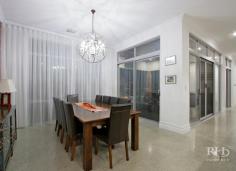 5C KISHORN ROAD Applecross WA 6153 $1,999,000 Register your interest today in this amazing home. Beautifully presented and as-new. This modern home makes no compromises with high-end designer interiors meeting elegant alfresco living on a superbly manicured 704sqm green-titled block with in-ground pool. The spacious single-level floor plan also offers plenty of space, for family living, and you’ll love this convenient family-friendly location that’s opposite Applecross Primary School parklands, and just moments to Ardross Street cafes and shops. -- Living/dining area with polished concrete floor, modern chandelier and stylish feature wall  -- High-end designer kitchen with stone bench tops, sleek cabinetry and premium appliances  -- Generous home office or additional living space off the main living/dining area  -- Carpeted, king-sized master bedroom with large walk-in robe through to luxury ensuite  -- Three large additional bedrooms plus an extra sitting room provides even more living space  -- Stunning main bathroom with twin vanity, bath, shower and private alfresco terrace  -- Large integrated entertainer’s patio features high-end alfresco kitchenette with fridge  -- Secure, manicured grounds plus a sparkling in-ground pool with frameless glass fence  -- Well-equipped internal laundry with plentiful cabinetry and powder room with vanity  -- Gated front access to private front yard with large lock-up garage and solar power system Secure gate entry ensures your privacy as you enter into the fully fenced front yard that features manicured lawns and a sparkling in-ground pool with frameless glass fence. Continue inside where the stylish open-plan living/dining area will impress with premium on-trend styling including polished concrete flooring, a raw brick feature wall, distinctive contemporary light fittings, an over-sized Plantation-style ceiling fan and a stunning atrium-style ceiling recess to the living area. The immaculate high-end kitchen will fulfil every home chef’s wildest dreams, and entertaining is a real treat on the large integrated patio with alfresco kitchenette. The king-sized master bedroom is another standout feature of the home with a large walk-in robe and luxury designer ensuite that features a striking freestanding bath, twin vanities, floor-to-ceiling tiles and a large open rain-head shower behind a stunning raw brick partition. An additional sitting room and a generous home office provide even more living space, and the large second, third and fourth bedrooms – all with built-in robes – share the quality family-sized main bathroom to complete this impressive package. For more info, call Frank Sanchez on 0419 367 999 or Mike Quirici on 0402 085 533. DISCLAIMER: Whilst every care has been taken with the preparation of the particulars contained in the information supplied, believed to be correct, neither the Agent nor the client nor servants of both, guarantee their accuracy. Interested persons are advised to make their own enquiries and satisfy themselves in all respects. The particulars contained are not intended to form part of any contract. 