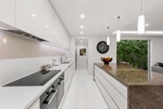  13 Edward Street Kew VIC 3101 $3,900,000 - $4,100,000 Positioned to perfection in one of the finest streets in the prestigious Sackville Estate, this extraordinary entertainer's home exudes quality and sophistication throughout. Set on 605sqm with extensive street frontage and beautifully landscaped gardens, this three-bedroom plus study single level residence is superbly appointed with luxurious living and dining options both inside and out. Awash with natural light and immaculately presented with sleek modern tones, ceramic floor tiles, granite benchtops and two-pac finishes, the jewel in the crown of this remarkable home is a wonderful open-plan living area that spans both inside and outside, complemented by a striking water feature to one side. A magnificent kitchen with island bench and butler's pantry opens to the relaxed family lounge with gas stone fireplace and adjacent dining zone, effortlessly flowing through bi-fold doors to an all-weather outdoor entertaining sanctuary complete with a full outdoor kitchen, automatic vergola and remote blinds. The timber deck extends further for sun-splashed alfresco enjoyment in the warmer months, providing yet another dining or entertaining space. Minimalist in style and expertly designed for the discerning family, it also comprises a stunning master suite with ensuite and extensive built-in robes, plus two further bedrooms (BIRs), sparkling central bathroom, a study or home office conveniently positioned on entry. An array of other features includes ducted heating and air conditioning, Miele kitchen appliances, TVs in every bedroom, separate laundry with powder room, Sonos sound system, security alarm and double garage with additional storage. Breathtaking from every angle, this quality home also enjoys a quality location within easy reach of Cotham Road trams, Kew Junction and elite private schools including Genazzano, Camberwell Grammar, MLC, Trinity and Ruyton. Truly unique and spectacular! 