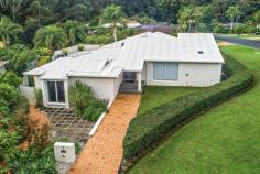  1 Kookaburra Close Boambee East NSW 2452 Ray White Coffs Harbour are proud to introduce 1 Kookaburra Close Boambee East. Positioned on an elevated corner block this impressive family home boasts striking street appeal with clean modern lines and loads of privacy. Architecturally designed, you will be wowed upon entry with soaring ceilings and high set windows creating a sense of space and providing an abundance of natural light. The centrepiece of the home is the well appointed kitchen with stone benchtops, quality appliances and loads of cupboard space. This area flows to both the large formal lounge room and casual living and dining areas. Each of bedrooms are of generous proportion with the main bedroom featuring an ensuite, while the master bathroom has enjoyed a recent renovation which adds to the appeal. The backyard is a true entertainers delight. Complete with a sparkling inground swimming pool, plus an expansive deck area and concrete terrace making it the perfect spot to relax or entertain in style with family and friends. For those of you looking to work from home, there is currently a salon in place with it's own separate entrance. It's ideal for hairdressers, beauty therapists or massage but could easily be modified to suit other uses. This amazing package is complete with a double garage, side access for trailer parking and low maintenance established gardens. Leaving plenty of time for families to enjoy the pristine Coffs Coast beaches. For further information or to book a viewing please contact Ray White Coffs Harbour. Land size 1,059m2 Council rates $2,998 per annum FEATURES: Air Conditioning Built-In Wardrobes Close To Schools Close To Shops Garden Polished Timber Floor Pool. 