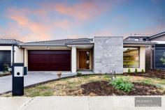  16 Wenn Avenue, Clyde North VIC 3978 A reflection of crisp modern style, this brand new family home sets a benchmark in easy living with its smooth interaction of casual living and indoor entertaining, while a wonderful alfresco zone spans out onto the backyard for effortless summertime BBQs. Beyond its striking facade, the home with its impressive high ceilings takes you through to a spectacular kitchen, living and dining zone that's adorned with stone benches, mirrored glass splashback, stainless steel appliances, 900mm gas cooktop, a dishwasher plus a walk-in pantry. The adjacent rumpus room creates a relaxed space for entertaining during the cooler winter months, while a superb alfresco zone extends freely onto the low-maintenance backyard. Carpet adds additional comfort throughout the four robed bedrooms; master with walk-in-robe and dual vanity ensuite, accompanied by a family bathroom with floor-to-ceiling tiling and separate toilet. Furthermore, the home boasts a laundry/butler's pantry, ducted heating, evaporative cooling plus a double garage with internal access.  Conveniently placed, close to St Peter's College, Clyde Primary, St Thomas the Apostle Primary, Eden Rise shops, Casey Central, buses, trains plus major arterials. 