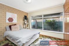  2 Glasgow St, Wendouree VIC 3355 $295,000 This neatly maintained brick veneer classic welcomes a retro uplift, a sympathetic renovation or vision for a new home (STCA) in this desirable pocket of Wendouree. Light & spacious, this single level home features a side entry, a sun kissed living room with gas heater, a split system and ceiling fan, glass doors to the meals area and an original kitchen with good storage above & below the preparation bench. There are three bedrooms, a central bathroom with separate toilet and an internal laundry. An ideal investment or for a first home buyer, this welcoming floor plan & sizable allotment with established gardens offers a single lock up garage, a single carport, a handy garden shed, room for off street parking and a low maintenance garden if considering an investment property. Rent appraised between $270 - $295 per week, this 70's home could increase its rental value with further improvement or a contemporary makeover. Glasgow Street sits within metres to the basketball, badminton and sport centre, while also providing proximity benefits to Stockland's shopping centre, schools, further recreational facilities and the Western freeway. 