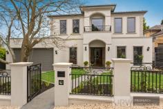  1 BIRCH STREET MOUNT WAVERLEY VIC 3149 Custom designed and individually built on an elevated north-facing block, this stylish and prestigious family home situated within only a short stroll to Mount Waverley Secondary College, Shops and Railway Station offers multi-zoned living, easily accommodating a large family while at the same time ensuring privacy for all.  Featuring lavish formal and relaxed living zones with an open floor plan and surrounded by a northerly garden aspect creating an inside/outside aura.  This residence features five bedrooms, all with private ensuites, and walk in robes (master bedroom downstairs) and a luxurious second Master suite upstairs, with an opulent separate bathroom. Other rooms includes a teenager's private retreat/ library and study nook wired for computers upstairs and whilst downstairs offers a fitted-out home office with built in bookshelves, ideal for those working from home. Those who love to cook would be delighted with the gourmet kitchen fitted with superb stone bench tops, butler's pantry, expansive island preparation area, with dual Miele appliances to suit the finest chef at heart. Flowing from the casual meals area is a fully appointed alfresco outdoor living room, boasting a gorgeous cedar lined ceiling, tiled floor, a natural gas barbeque, sink, stone bench top and storage cabinets all overlooking a beautifully landscaped, low maintenance garden to complete your entertaining needs. A spacious laundry with direct access to the 3 car garage is fitted with double internal drying cabinets, laundry chute and stone bench tops all opening onto an elevated, outdoor, tiled area overlooking a separate garden setting. You will find all this and more behind the front wrought iron fence with double remote controlled gates that offers security to those who reside. 