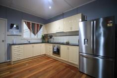  11 Davenport St Ayr  QLD 4807 $279,000 First home buyers will be immediately attracted to this potential and value this 3/4 bedroom low set family home has to offer... Positioned neatly on a fully fenced 812m2 town block close to schools, CBD and all necessary amenities... Welcome inside.... All 3 bedrooms offer polished hardwood timber floors. Two are airconditioned with built ins in one... The fourth bedroom/multipurpose room is spacious and tiled with built in toilet amenities and located conveniently opposite the internal laundry. The family brags both shower and soothing tub with separate toilet and easily accessed from all 3 bedrooms... With its freshly painted modern neutral interior... the open plan layout will suit everyone! Once again highlighted with polished timber floors and air conditioning there is ample living and dining... A recent reno to the kitchen see's it fitted with quality appliances and fixtures, bench and prep space and an abundance of cupboards.... Venture outside to the newly erected undercover fanned ent/bbq area and view the large 2 bay powered man cave for hubby... Designed to house those much needed "big boy's toys"... Carport parking is available for one and a very teat 5kw solar is a very nice surprise.... She's a pretty neat package a would suit so many... Hurry and call to arrange your immediate inspection today...  FEATURES Fenced Safety Switch Smoke Alarms Pump & Bore solar 