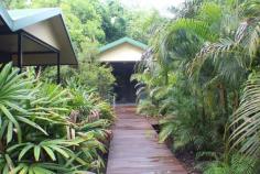 111 Balanda Drive Dundee Beach NT 0840 $650,000 This property was established by a group of families and has four villas elevated by decked walkways and tropical gardens with a large entertainment hall. Set on 9090 m2 or 2.2 Acres this is the The Ultimate Weekender for Family and/ or Friends as only 2 Blocks (just a short walk) from the Beach and 2.5 km From Dundee Lodge and boat ramp. Features  • 	 Main Building 8 x23.5m • 	 5 x 2 Bedroom Cabins 9.2x3.4m (can sleep up to 25-30 people). • 	 All fully air-conditioned • 	 Nestled in rain forest with own verandah. • 	 All Cabins connected by raised timber walkway with runway lights. • 	 Ablution Block Adjoining main building. • 	 3 x Toilets • 	 3 x Showers • 	 Double Laundry Tub with Washing Machine • 	 302 Solar Hot Water System • 	 1 Outside Shower • 	 A BBQ Gazebo area with power and water  • 	 Unique Salt water swimming pool with spa jets and underwater coloured light.  • 	 Property is fully fenced and has 2 gates at front of block for drive in and drive out.  • 	 A gate is also at rear of block. • 	 4 large water tanks capacity of 100000 litres  • 	 2 smaller tanks capacity 6000litres is also available • 	 Septic and grey water system installed. • 	 A 20 FT Container hidden in the forest serves as a shed. 