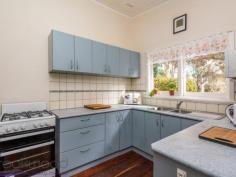  90 Scott Street Boya WA 6056 $449,000 Proudly displaying its mid-century credentials, this 1964-built home offers a sense of open, easy living with high ceilings, a flowing floorplan and a spectacular outlook to the enchanting Boya landscape. Sitting well back from the road, tall trees and a series of raised garden beds create a sense of privacy in a property that offers ample and an elevated rear deck with national park views and a below ground pool. 4 bedrooms 1 bathroom 1964-built bungalow Lounge library sunroom Formal & informal dining Beautiful timber floors Open-plan high/ceilings Elevated east facing deck Pool & garden sheds 2023 sqm adjoins reserve Schools, shops, NP views A broad gable roofline gives this home a sense of organic connection to its site and declares the aesthetic and floorplan that awaits behind the front door. A small front deck leads to the front door and into an expansive lounge/dining room. Jarrah floors glow against white walls and high ceilings with exposed beams emphasise the sense of light and space. Anchoring the lounge/dining room is a decorative, white painted fireplace with ornate mouldings, currently decommissioned, the present owners rely on reverse cycle air-conditioning for climate control. Double French doors open into a spacious timber-lined library, this flexible space could be adapted for use as a theatre room, home office or games/activity room. A separate kitchen is arranged at one end of the central living area and offers a freestanding oven, corner pantry and U-shaped bench. A large laundry adjoining the kitchen could be utilised as a larder or butler’s pantry. Further potential exists in the storage space accessible from the laundry. This light and spacious workspace opens to a small private courtyard. Arranged along the home’s eastern side is a large sunroom; a beautiful, elevated space and the perfect spot for whiling away a lazy afternoon, gazing out to the everchanging landscape of Greenmount National Park. If you prefer livelier pastimes, a wide sliding door opens the sunroom to the rear deck to create an indoor-outdoor entertaining zone with spectacular views. A large store room adjoins the laundry and opens to a small private courtyard. Two bedrooms are arranged off the sunroom, the larger features a walk-in robe and both enjoy views to the national park. All four of the bedrooms are a good size and share the family bathroom. Outdoors, paths lead to the below ground pool where a native landscape and views of the national park ensure privacy and a sense of floating in your private billabong. This sense of privacy is reinforced by the reserve adjoining the property’s rear boundary. There is much to love and much potential here; a mid-century home with multiple living areas, good-sized bedrooms and ample space to entertain. The 2023 sqm lot ensures privacy and a sense of space while the location puts good schools and the services and amenities of town within easy reach. 