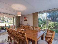  8 Painter Crescent Mundaring WA 6073 $549,000 Take the plunge and dive into life in the Hills in this 4 bedroom, 2 bathroom home built for indoor-outdoor living and set on a 2017 sqm lot. Boasting a sparkling decked pool, fantastic dining pavilion and superb alfresco entertaining area, this family home is tucked away on a leafy crescent, steps from Mundaring Primary School, an easy walk to Stoneville Road and minutes from the bustling Mundaring Village. This 1999-built brick and iron home offers the best of Hills living with privacy, convenience and green-hued serenity. 4 bedrooms 2 bathrooms 1999-built brick and iron Stylish modern kitchen Relaxed open-plan living Fabulous dining pavilion Big gabled alfresco ent. Sparkling decked pool ½-acre fenced backyard Walk Mundaring Village Life in the Hills is a life filled with the beauty of the great outdoors – this 4 bedroom, 2 bathroom has been created to embrace that beauty. The modern and stylish home offers open-plan living and a fabulous all-seasons dining pavilion. The ½-acre level block sits on a hidden Mundaring crescent, minutes from the local primary school and with walking tracks to bus stops on Stoneville Road and the Mundaring Village. Surrounded by an atmosphere of privacy and serenity, the front door of this brick and iron home opens to an open-plan family/dining/kitchen. Warm toned-floors, fresh, white walls and a slow combustion fire offer an instant welcome, a welcome that is extended with style thanks to a fabulous dining pavilion adjoining the living area. Screened doors on three sides open this flexible and practical room to a small patio at the front of the home and the expansive alfresco entertaining area looking across the decked pool and lightly-treed backyard. Whether you are entertaining friends or enjoying the alfresco life with family, the well-designed kitchen puts everything in place to make for easy meal prep. An electric hob and oven, dishwasher and corner pantry are surrounded by hi-gloss white cabinetry and a benchtop and breakfast bar. The expansive alfresco entertaining area provides additional space for preparing meals with a fitted bench and ready-made barbeque area. Melding seamlessly with the dining pavilion and open plan living area, this covered space sits surrounded by lawn and gardens and overlooks the sparkling decked pool. With room for a large table and a separate seating area, paths lead to raised vegetable beds – fresh herbs to hand when you need them – and out to the fully-fenced backyard and garden shed. Clearly built for enjoying the outdoors, the home also provides stylish and comfortable interior spaces. The main bedroom suite offers a serene retreat with an ensuite and large mirrored wardrobe. A ceiling fan and soft carpets extend the pampering atmosphere while garden views fill the room with a gentle, green-hued light. The 3 junior bedrooms – carpeted and fitted with wardrobe recesses – also enjoy views of the garden. A family bathroom, with shower, tub and vanity, is arranged beside the walk-through laundry with separate W.C. Discover life in the Hills at its best in this beautifully present, perfectly placed home. Dive into a sea of green with great indoor-outdoor living, a fully-fenced backyard and sparkling salt water pool. Hidden yet centrally located, this property balances privacy and convenience with easy access to schools, public transport and the bustling village of Mundaring. 