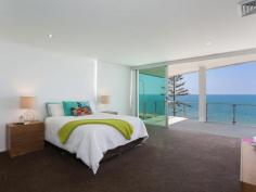  115 Margate Pde, Margate -  Waterfront Properties Redcliffe ULTIMATE IN LUXURY LIVING This luxurious masterpiece will impress from start to finish. Boasting the perfect location, this architecturally designed and built home offers outstanding vistas and a waterfront lifestyle second to none. Properties of this calibre and location are rarely offered to the market. Move in and enjoy being surrounded by the absolute quality this immaculate residence offers…… not to mention waking to the sound of waves rolling gently onto the foreshore, sunrise peeping over the horizon and the moon shimmering across the bay at the close of play …….. just amazing. The user-friendly design features high ceilings and spacious light filled rooms with a floor plan that spans 3 levels of designer brilliance, this home ticks every box. Providing the ultimate in executive entertainment with a full wet bar and pool room flowing onto the extensive deck, where you will spend hours enjoying the endless views across the bay or alternatively, move to the sanctuary of the media room to choose from a full range of entertainment options. The huge feature packed gourmet kitchen leaves nothing to be desired. Including a massive island bench ideally positioned to take in the glorious bay views. Miele appliances including dishwasher, 900mm induction cook top, steam oven, plate warmer and microwave with an abundance of storage. The third level master bedroom epitomises luxury with extensive bay vista pouring into the room, massive open area ensuite and WIR. A further three double sized bedrooms, all with large WIRs, a second ensuite, main 2 way bathroom/ensuite and powder room provides for all the family and guests with ease. Massive 674sqm of luxuriously appointed living Additional Features: - Huge home office - The basement level has space for all the toys, including up to 8 car spaces with large storage room, second laundry and powder room. - Very Low maintenance, fully landscaped block with a 23,000 litre inground, concrete water tank. - Ducted air throughout - Polished timber staircases - Huge well appointed laundry - Vacuum maid - Intercom - Security alarm system - Water and power to all balconies - Efficient Heat pump hot water system - Provision, plans and approval for lift and pool. From this gorgeous home, stroll in either direction for kilometres without leaving the sandy shores of the bay. Perched on arguably the premium strip of beach on the Peninsula, this home is simply …….the ultimate in luxury waterfront living. Property Code: 590 