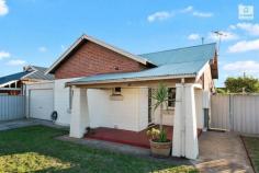  38 Main Street Beverley SA 5009 Be quick to secure this Character home on an easy care CORNER block at an affordable price! With a formal lounge (with gas heater) and semi-formal dining (both with polished timber floorboards and wall air-conditioners), this warm and cosy home also has two larger bedrooms with built in robes that will suit a large section of the market. The bathroom and kitchen have been upgraded and the laundry leads to the separate toilet. A covered rear entertaining area is the perfect spot for a family BBQ and gets lovely northern light in the winter. The covered carport/garage (with auto roller door) allows for 3 smaller or 2 larger cars plus room for another off street for those who need it. People who have seen it so far also love the high ceilings, character features (fireplace and timber work), the fireplace in bedroom 2, the gas stove and instant hot water … and the fact that the shower is separate from the bath. Situated close to so much: Welland Plaza, Arndale Shopping Centre, Queen Elizabeth Hospital, Adelaide City, Entertainment Centre, Kilkenny Primary School, the railway station, Titanium Security Basketball Stadium and so much more. You will never have to travel far to be entertained. This will suit first home buyers, investors or down-sizers not wanting to go into a unit. This is the best title you can get, a Torrens Title, meaning that you never have to have meetings with other unit owners. 