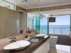 115 Margate Pde, Margate -  Waterfront Properties Redcliffe ULTIMATE IN LUXURY LIVING This luxurious masterpiece will impress from start to finish. Boasting the perfect location, this architecturally designed and built home offers outstanding vistas and a waterfront lifestyle second to none. Properties of this calibre and location are rarely offered to the market. Move in and enjoy being surrounded by the absolute quality this immaculate residence offers…… not to mention waking to the sound of waves rolling gently onto the foreshore, sunrise peeping over the horizon and the moon shimmering across the bay at the close of play …….. just amazing. The user-friendly design features high ceilings and spacious light filled rooms with a floor plan that spans 3 levels of designer brilliance, this home ticks every box. Providing the ultimate in executive entertainment with a full wet bar and pool room flowing onto the extensive deck, where you will spend hours enjoying the endless views across the bay or alternatively, move to the sanctuary of the media room to choose from a full range of entertainment options. The huge feature packed gourmet kitchen leaves nothing to be desired. Including a massive island bench ideally positioned to take in the glorious bay views. Miele appliances including dishwasher, 900mm induction cook top, steam oven, plate warmer and microwave with an abundance of storage. The third level master bedroom epitomises luxury with extensive bay vista pouring into the room, massive open area ensuite and WIR. A further three double sized bedrooms, all with large WIRs, a second ensuite, main 2 way bathroom/ensuite and powder room provides for all the family and guests with ease. Massive 674sqm of luxuriously appointed living Additional Features: - Huge home office - The basement level has space for all the toys, including up to 8 car spaces with large storage room, second laundry and powder room. - Very Low maintenance, fully landscaped block with a 23,000 litre inground, concrete water tank. - Ducted air throughout - Polished timber staircases - Huge well appointed laundry - Vacuum maid - Intercom - Security alarm system - Water and power to all balconies - Efficient Heat pump hot water system - Provision, plans and approval for lift and pool. From this gorgeous home, stroll in either direction for kilometres without leaving the sandy shores of the bay. Perched on arguably the premium strip of beach on the Peninsula, this home is simply …….the ultimate in luxury waterfront living. Property Code: 590 