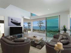  115 Margate Pde, Margate -  Waterfront Properties Redcliffe ULTIMATE IN LUXURY LIVING This luxurious masterpiece will impress from start to finish. Boasting the perfect location, this architecturally designed and built home offers outstanding vistas and a waterfront lifestyle second to none. Properties of this calibre and location are rarely offered to the market. Move in and enjoy being surrounded by the absolute quality this immaculate residence offers…… not to mention waking to the sound of waves rolling gently onto the foreshore, sunrise peeping over the horizon and the moon shimmering across the bay at the close of play …….. just amazing. The user-friendly design features high ceilings and spacious light filled rooms with a floor plan that spans 3 levels of designer brilliance, this home ticks every box. Providing the ultimate in executive entertainment with a full wet bar and pool room flowing onto the extensive deck, where you will spend hours enjoying the endless views across the bay or alternatively, move to the sanctuary of the media room to choose from a full range of entertainment options. The huge feature packed gourmet kitchen leaves nothing to be desired. Including a massive island bench ideally positioned to take in the glorious bay views. Miele appliances including dishwasher, 900mm induction cook top, steam oven, plate warmer and microwave with an abundance of storage. The third level master bedroom epitomises luxury with extensive bay vista pouring into the room, massive open area ensuite and WIR. A further three double sized bedrooms, all with large WIRs, a second ensuite, main 2 way bathroom/ensuite and powder room provides for all the family and guests with ease. Massive 674sqm of luxuriously appointed living Additional Features: - Huge home office - The basement level has space for all the toys, including up to 8 car spaces with large storage room, second laundry and powder room. - Very Low maintenance, fully landscaped block with a 23,000 litre inground, concrete water tank. - Ducted air throughout - Polished timber staircases - Huge well appointed laundry - Vacuum maid - Intercom - Security alarm system - Water and power to all balconies - Efficient Heat pump hot water system - Provision, plans and approval for lift and pool. From this gorgeous home, stroll in either direction for kilometres without leaving the sandy shores of the bay. Perched on arguably the premium strip of beach on the Peninsula, this home is simply …….the ultimate in luxury waterfront living. Property Code: 590 