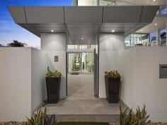  115 Margate Pde, Margate -  Waterfront Properties Redcliffe ULTIMATE IN LUXURY LIVING This luxurious masterpiece will impress from start to finish. Boasting the perfect location, this architecturally designed and built home offers outstanding vistas and a waterfront lifestyle second to none. Properties of this calibre and location are rarely offered to the market. Move in and enjoy being surrounded by the absolute quality this immaculate residence offers…… not to mention waking to the sound of waves rolling gently onto the foreshore, sunrise peeping over the horizon and the moon shimmering across the bay at the close of play …….. just amazing. The user-friendly design features high ceilings and spacious light filled rooms with a floor plan that spans 3 levels of designer brilliance, this home ticks every box. Providing the ultimate in executive entertainment with a full wet bar and pool room flowing onto the extensive deck, where you will spend hours enjoying the endless views across the bay or alternatively, move to the sanctuary of the media room to choose from a full range of entertainment options. The huge feature packed gourmet kitchen leaves nothing to be desired. Including a massive island bench ideally positioned to take in the glorious bay views. Miele appliances including dishwasher, 900mm induction cook top, steam oven, plate warmer and microwave with an abundance of storage. The third level master bedroom epitomises luxury with extensive bay vista pouring into the room, massive open area ensuite and WIR. A further three double sized bedrooms, all with large WIRs, a second ensuite, main 2 way bathroom/ensuite and powder room provides for all the family and guests with ease. Massive 674sqm of luxuriously appointed living Additional Features: - Huge home office - The basement level has space for all the toys, including up to 8 car spaces with large storage room, second laundry and powder room. - Very Low maintenance, fully landscaped block with a 23,000 litre inground, concrete water tank. - Ducted air throughout - Polished timber staircases - Huge well appointed laundry - Vacuum maid - Intercom - Security alarm system - Water and power to all balconies - Efficient Heat pump hot water system - Provision, plans and approval for lift and pool. From this gorgeous home, stroll in either direction for kilometres without leaving the sandy shores of the bay. Perched on arguably the premium strip of beach on the Peninsula, this home is simply …….the ultimate in luxury waterfront living. Property Code: 590 