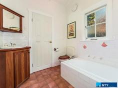  203 Whatley Crescent Bayswater WA 6053 $739,000 This lovely character home with high ceilings, Jarrah floorboards, stained glass entry way and art deco features was built in 1931, and sits on 782 sqm’s of prime real estate in the recently rezoned Meltham Station Precinct Structure Plan. The house has three large bedrooms, two with built-in robes/storage and one with a fireplace. At the end of the central hall is a shower/toilet, before leading into a large kitchen with a Belling twin-fronted electric oven with seven gas-top burners. There are reverse cycle, split air-conditioners in two bedrooms and the living room, which also has a gas spear for winter heating. The lounge-dining area is framed by French doors which open onto a stunning 36 sqm Jarrah deck protected by a pitched roof, tastefully designed in keeping with the period style of the house and fabulous for all-weather entertaining. The southern end of the living room opens into a second bath/toilet and houses the laundry facilities behind a separate door. From the deck itself you look into a magnificent garden of mature trees which have been chosen for summer shade, autumn splendour and spring blossoms. It’s a wonderfully peaceful and private space: you’d never know you were just a three minute walk to the train station (nine minute ride into town) and 5.5km’s from the CBD by car. The lawns are fully reticulated by bore, and its Davey pump was replaced in 2016. There is also a 1,260 litre rainwater tank by the side of the house for general use. There are 10 solar panels on the roof helping with power bills, as well as a high-tech Solargain hot water system installed in 2015, feeding a 315 litre storage unit with an electric boost for winter. These charming homes on big blocks close to the city are now very rare and this one won’t last long. Walking distance to shops and cafes – it’s ideal for a professional couple or young family looking for the inner city lifestyle with an old fashioned backyard, or land to extend if required, or the savvy investor who can clearly envisage the development potential in this block-o-tunity. Features – 	 782 sqm’s land in Meltham Station Precinct – 	 Three large bedrooms – 	 Two bathrooms / two toilets – 	 Jarrah floorboards – 	 36 sqm covered Jarrah deck – 	 Three split system air-cons – 	 High ceilings – 	 Antique and vintage light fittings – 	 Belling twin oven with seven gas burners – 	 Gas spear in living room – 	 1,260 litre water tank – 	 10 solar panels – 	 Solar hot water with 315 litre tank – 	 Close to shops, cafes, schools – 	 Established garden – 	 250m to train station, 5.5kms to CBD. 