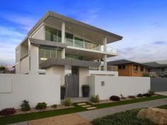  115 Margate Pde, Margate -  Waterfront Properties Redcliffe ULTIMATE IN LUXURY LIVING This luxurious masterpiece will impress from start to finish. Boasting the perfect location, this architecturally designed and built home offers outstanding vistas and a waterfront lifestyle second to none. Properties of this calibre and location are rarely offered to the market. Move in and enjoy being surrounded by the absolute quality this immaculate residence offers…… not to mention waking to the sound of waves rolling gently onto the foreshore, sunrise peeping over the horizon and the moon shimmering across the bay at the close of play …….. just amazing. The user-friendly design features high ceilings and spacious light filled rooms with a floor plan that spans 3 levels of designer brilliance, this home ticks every box. Providing the ultimate in executive entertainment with a full wet bar and pool room flowing onto the extensive deck, where you will spend hours enjoying the endless views across the bay or alternatively, move to the sanctuary of the media room to choose from a full range of entertainment options. The huge feature packed gourmet kitchen leaves nothing to be desired. Including a massive island bench ideally positioned to take in the glorious bay views. Miele appliances including dishwasher, 900mm induction cook top, steam oven, plate warmer and microwave with an abundance of storage. The third level master bedroom epitomises luxury with extensive bay vista pouring into the room, massive open area ensuite and WIR. A further three double sized bedrooms, all with large WIRs, a second ensuite, main 2 way bathroom/ensuite and powder room provides for all the family and guests with ease. Massive 674sqm of luxuriously appointed living Additional Features: - Huge home office - The basement level has space for all the toys, including up to 8 car spaces with large storage room, second laundry and powder room. - Very Low maintenance, fully landscaped block with a 23,000 litre inground, concrete water tank. - Ducted air throughout - Polished timber staircases - Huge well appointed laundry - Vacuum maid - Intercom - Security alarm system - Water and power to all balconies - Efficient Heat pump hot water system - Provision, plans and approval for lift and pool. From this gorgeous home, stroll in either direction for kilometres without leaving the sandy shores of the bay. Perched on arguably the premium strip of beach on the Peninsula, this home is simply …….the ultimate in luxury waterfront living. Property Code: 590 