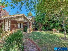  203 Whatley Crescent Bayswater WA 6053 $739,000 This lovely character home with high ceilings, Jarrah floorboards, stained glass entry way and art deco features was built in 1931, and sits on 782 sqm’s of prime real estate in the recently rezoned Meltham Station Precinct Structure Plan. The house has three large bedrooms, two with built-in robes/storage and one with a fireplace. At the end of the central hall is a shower/toilet, before leading into a large kitchen with a Belling twin-fronted electric oven with seven gas-top burners. There are reverse cycle, split air-conditioners in two bedrooms and the living room, which also has a gas spear for winter heating. The lounge-dining area is framed by French doors which open onto a stunning 36 sqm Jarrah deck protected by a pitched roof, tastefully designed in keeping with the period style of the house and fabulous for all-weather entertaining. The southern end of the living room opens into a second bath/toilet and houses the laundry facilities behind a separate door. From the deck itself you look into a magnificent garden of mature trees which have been chosen for summer shade, autumn splendour and spring blossoms. It’s a wonderfully peaceful and private space: you’d never know you were just a three minute walk to the train station (nine minute ride into town) and 5.5km’s from the CBD by car. The lawns are fully reticulated by bore, and its Davey pump was replaced in 2016. There is also a 1,260 litre rainwater tank by the side of the house for general use. There are 10 solar panels on the roof helping with power bills, as well as a high-tech Solargain hot water system installed in 2015, feeding a 315 litre storage unit with an electric boost for winter. These charming homes on big blocks close to the city are now very rare and this one won’t last long. Walking distance to shops and cafes – it’s ideal for a professional couple or young family looking for the inner city lifestyle with an old fashioned backyard, or land to extend if required, or the savvy investor who can clearly envisage the development potential in this block-o-tunity. Features – 	 782 sqm’s land in Meltham Station Precinct – 	 Three large bedrooms – 	 Two bathrooms / two toilets – 	 Jarrah floorboards – 	 36 sqm covered Jarrah deck – 	 Three split system air-cons – 	 High ceilings – 	 Antique and vintage light fittings – 	 Belling twin oven with seven gas burners – 	 Gas spear in living room – 	 1,260 litre water tank – 	 10 solar panels – 	 Solar hot water with 315 litre tank – 	 Close to shops, cafes, schools – 	 Established garden – 	 250m to train station, 5.5kms to CBD. 