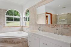  96 Bundara Park Dr Tuckombil NSW 2477 $1.55m Grand in proportions & large in size - this home is perfect for large or blended families - all wanting their own space to grow & stretch on this elevated two & a half acre private estate! At the end of a picturesque country cul-de-sac & on top of the plateau is this property - both inviting & impressive in an endearing way. Capturing views & sunsets to the west,  this large modern home is accessed by a fully sealed driveway meandering through estate like grounds, ensuring a welcoming & impressive entrance. Positioned in the centre of the home are multiple living areas with fretwork & bay windows & a modern country kitchen with granite benchtops continuing the farmhouse theme. The living room features a slow combustion fire keeping you toasty in winter The oversized master suite is located at one end of the home, with ensuite & walk in robe whilst the three double bedrooms are located along with the guest bedroom & family bathroom for independence to the other end of the home.   With almost all rooms flowing through French doors to return verandas - there is space for everyone to while away the summer days, entertain by the pool, meditate in the gazebo or soak up the winter sun. Expansive paved areas perfect for lazy barbeques adjoin the area at the rear which leads to the salt water inground pool & also provides access to the spacious garage.   With a bathroom & air conditioned loft for additional guests, teenagers or home office this space is ideal for those working from home or convert to a studio (STCA). A bore provides an abundant supply of crystal clear water.  In what is an extremely convenient dress circle location with buses at door & only a short 10 minute drive to Alstonville for shops & services & less than 20 minutes to the beaches of Lennox Head & Ballina airport. For private viewings call Mary O'Connor on 0418 462 849 Features Verandah Terrace/Paved Indoor entertainment area Outdoor entertainment area Smoke Alarms in-Ground Pool 
