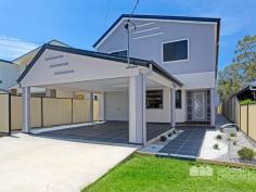  20 Lime Street, Redcliffe -  Waterfront Properties Redcliffe Massive Family Home - Huge Price Reduction! Features Over 40 squares of living  Fully ducted & zoned air-conditioning  Backs onto parkland  Walking distance to Dolphins Shopping Centre  Immaculately presented throughout (as new)  6 Bedrooms + Office  4.5 bathrooms  3 car accommodation Call Kevin to arrange an immediate inspection. 