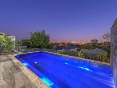  12 Rupert Street Windsor QLD 4030 Beautifully crafted and intuitively designed for a lifestyle of convenience and exclusivity, this exceptional home has been impeccably appointed over multiple levels. This generously proportioned, architect designed residence is a haven of space and light. With 180-degree panoramic views it creates an exceptional Brisbane city backdrop from every level. Situated in a premier street of Windsor, the home reveals a brilliant ultra-modern layout intelligently crafted with impressive living and dining areas. The true heart of any home is the kitchen and this one is sure to delight! Complete with a true butler's pantry and a full complement of quality appliances including, Pitt Drum cook top with 4-gas brass burners and ILVE range hood, Gaggenau combi-air and combi-steam ovens, warming draw, along with an integrated coffee machine, microwave and dishwasher. The refrigerator and freezer are also integrated to maintain the design's sleek clean lines. The cabinetry has soft close fittings and is delightfully finished with stunning marble bench tops. The dining area leads out to an elevated entertainment deck, capturing the incredible views. This space is complete with a built-in barbecue and beer fridge, providing the perfect tools to create your culinary delights and making entertaining an absolute breeze. Excite your senses with a built-in fire pit on the deck, lit with the push of a button! Downstairs, a second living area boasts a full wet bar with beer and wine fridges and spills out to an additional entertainment area and the sparkling pool. The master suite features a large walk-in robe with automatic floor lighting, a hotel-style ensuite with stunning bathtub and a private balcony with superb city vistas. The other bedrooms are all double sized, three of them have walk-in-robes and the fifth bedroom on the lower level also has its own bathroom, making it perfect as guest accommodation. This sensational home is filled with additional extras beyond what you might imagine. Some of these include: • Grand feature stone foyer with stunning bespoke chandelier • Marble bench tops in kitchen, living & all bathrooms • Stunning Spotted Gum timber floors throughout • Gaggenau appliances + butler's pantry with an instant hot water tap • Multiple living areas & fantastic entertaining + saltwater pool • Luxurious master suite with ensuite & WIR with powder station • Additional 4 generously sized bedrooms (3 with WIR) + study • Zoned ducted air-con, gas fireplace in living room & fire pit on rear deck • 6-star energy rating, keyless entry and CCTV • SecureView screens + 44 solar panels (12.1kw) with inverter • Laundry with chute & great storage with built-in shelves and cupboards • Garage accommodation for 2 vehicles with built-in storage cupboards With such a great location on the doorstep of the CBD, this home provides access to so many wonderful local amenities. The Windsor Homezone Centre, Newmarket Village and Lutwyche Shopping Centres are all just a short drive away with all your shopping and restaurant needs. Handy to Downey Park providing you with an array of sporting facilities. It's so convenient to access the CBD and if you require, buses and trains are nearby. Located in the Windsor School Catchment, the Clem7, ICB and Gympie Road are nearby and so getting in around the city or heading to the Coast is a breeze. The Royal Brisbane Women's Hospital (RBWH), QUT and the new Herston Quarter redevelopment are just a short drive away. 