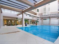  16 / 146 Prince Edward Parade, Scarborough -  Waterfront Properties Redcliffe Right on the Bay! There are just so many features to enjoy if you move into 'The Bay' complex at Scarborough - which is described by residents as a "Happy building". Not only is Unit 16 a very spacious (199m2) three bedroom apartment, but its design is practical and well thought out. With views that cannot be built out you will always be able to enjoy the gorgeous Bay outlook plus the delightful pretty night lights of both Redcliffe and all the way back to the Port of Brisbane. It's important for buyers to know that any new home built on the visible vacant block has a height restriction - the same level as the ones either side, so you will always have a water view. The very large Master bedroom opens up to the balcony facing the Queens Beach, so you can fall to sleep listening to the water lapping at the foreshore. Both ensuite and spare bathroom are bigger than most and the apartment has tons of storage cupboards throughout. Superbly located approximately halfway between Redcliffe and Scarborough, you can walk out the door and decide which way you fancy wandering off for your morning walk!  It's such a desirable lifestyle choice with happy residents who enjoy an living in an attractive, well-serviced building. The lovely foyer features a gorgeous pool, spa, gym and large common area.  Even the secure basement carpark is well-serviced, with a bathroom (ideal if you are downstairs in your garage area),a car wash station along with direct access to the beachfront via a tunnel walkway (meaning you can wheel a kayak or bikes from your garage through to the waterfront). Fully enclosed double garages are rare in unit complexes and this one is certainly bigger than average with plenty of storage room - perfect for those down-sizing from larger family homes who still want somewhere to 'potter or tinker'.  As there is no road in front of this unit, there is minimal (if any) traffic noise either! This lovely apartment is well worth an inspection, so it should definitely be on your list of apartments to view! This unit features: •	Spacious 199m2 of living  •	Three good-sized bedrooms  •	Study nook  •	Large bathrooms  •	Separate laundry  •	Two separate balconies  •	Water views from your kitchen, living area and front balcony  •	Plantation shutters throughout  •	Freshly re-painted internally  •	Access to pool, spa, gym roof-top  •	Great location with direct access to walking paths and the beach  •	Large double lock-up garage in secure basement carpark  •	NBN ready You need to make an appointment to view this apartment to appreciate all of the above, so call Karen Prince now on 0437 015 951 to arrange a time! 