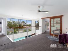  1 Landsborough Avenue, Scarborough -  Waterfront Properties Redcliffe Sleek and Stylish Family Home This modern stylish family home on a 405m2 block has been masterfully designed to make use of all available space. Feature packed this quality built home is supremely appointed and boasts the following: Expansive parents retreat with WIR, luxurious ensuite complete with twin shower, his and hers vanities and double spa bath, private balcony with water views 3 additional bedrooms with BIR  2 Living areas  Media room  Gourmet kitchen with servery to alfresco area + 6 burner gas stove, walk in pantry  Ultra modern main bathroom, ensuite, powder room  Good size laundry  Double lock-up garage + additional oversize garage perfect for the caravan or boat, enough room for all the toys  Relax in the resort style Magnesium pool with spa and waterfall features  Fantastic outdoor area for entertaining  Beautiful established gardens  Fully fenced with intercom at the gate  Solar power  Ceiling fans throughout  Walking distance to Scarborough Village and Southern Cross & Tech Colleges. No expense was spared when this impressive home was built. With too many features to possibly list, this is a must to inspect. Call Mark on 0413 447 576 to arrange an immediate inspection! 