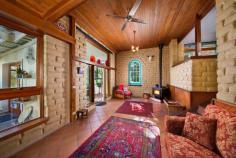  14 Cumberland Street  Katoomba NSW 2780 Majestically positioned at the summit of this beautifully maintained lifestyle property, overlooking the established gardens & capturing the music of a bubbling, crystal clear, mountain stream. Your senses are awakened as you realise this could be your very own slice of Blue Mountains paradise. Handcrafted stabilised sandstone, and blackened railway sleepers signify that this is no ordinary mountains home, built to last an eternity, and sympathetic to its surrounds, this much loved family home on 3500m2 (approx) is only 5 minutes to Leura Mall or Katoomba, has been cleverly designed for comfort, privacy & cold climate efficiency. Features include: 4 bedrooms plus a study or 5th bedroom, 2 bathrooms, raked timber ceilings & exposed timber beams, reclaimed leadlight windows, hydraulic underfloor heating, solar panels, lock up garage, as well as a diverse collection of both native and exotic flora & fauna. 
