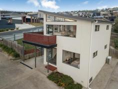  1/8 Skala Road  Tranmere TAS 7018 $400,000  Set across two levels providing sprawling views of the Derwent River, Hobart and the iconic Kunyanyi/Mt Wellington, this two bedroom Townhouse represents excellent buying in the Tranmere market. Featuring high cathedral ceilings and an open plan layout, the property benefits from an abundance of natural light and all day sun. The property also provides level off street parking for two vehicles and a neat and easy to maintain yard. Positioned close to the water, the Tranmere foreshore and walking track is less than 500 metres away and you are only 5 minutes drive to Shoreline Shopping Centre and Hotel, as well as multiple schools, parks and sporting grounds. 2 bed, 1 bath, OSP for 2 vehicles Water, city and mountain views All day sun, light filled rooms Walk to Tranmere foreshore, beaches Close to schools, bus routes, shops Reverse cycle a/c FEATURES: Air Conditioning Built-In Wardrobes Close To Schools Close To Shops Close To Transport Garden 