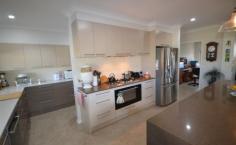  48-54 MARTIN PLACE TAMBORINE QLD 4270 $899,000.00 This amazing 4078 m2 Elevated property is in the Prestige "Riemore Downs" in one of best and ideal locations of Tamborine Village. This particular property boasts stunning views of Tamborine Mountain and the surrounding Ranges. This Architect Designed home was created by the current owners, who did not plan to leave so soon, as it is less than 12 months old.  Reluctant as they are, this will be to your benefit, as money was not spared in the making it literally a "Dream Home".  Loads of Bells and Whistles as you walk around the five bedrooms, all with built in robes, the master with walk-in and ensuite, the spacious well designed open plan kitchen, has stainless steel appliances with a 900mm Gas stove with Fan Forced oven, Stone bench tops and a very efficient walk in Butler's Pantry. The open plan living has thoughtfully set up three separate living areas, offering you a large family room and lounge that leads out to the Alfresco with a great entertainment and BBQ area.  Light and Airy with reverse Cycle Split Systems Air Conditioning as well as ceiling fans throughout the complete house. Back to the Grid 6klw Solar power keeps the bill very low.  Simple low maintenance design Landscape with a 16m x 9m Colourbond Shed, with plenty of room for a pool or a larger shed should you desire.  You will be impressed by this home and not disappointed.   Airconditioning, Broadband, Built In Robes, Courtyard, Dishwasher, Ducted Cooling, Ducted Heating, Ensuite, Fully Fenced, Grey Water System, Open Spaces, Outdoor Entertaining, Pay TV, Remote Garage, Rumpus Room, Secure Parking, Shed, Solar Hot Water, Solar Panels, Water Tank, Workshop, 