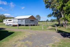  75 Armstrong street Biddaddaba QLD 4275 $595,000 Do not miss this opportunity to acquire a unique horse property with over 8 Acres of good usable flat arable land, adjacent to approximately 300 mtrs of "Biddaddaba Creek Frontage" with amazing views of the surrounding Ranges, located just 15 minutes from the Popular Country Town of Canungra, which is a comfortable 15 minutes drive to Nerang and the Pacific Hwy. There are two homes, one is an original "Country Cottage" with three bedrooms, one bathroom, kitchen, lounge and dining area and carport, The second being a two bedroom Container built home with modern kitchen, lounge and bathroom etc, with a large veranda with stunning views of the Ranges, plus a double garage, both homes have reverse cycle Air Conditioning. The Paddocks are fully fenced with a two Bay stable complex and Tack room. The property has three phase power available, ADSL Internet and a Water Bore with Potable Water and a Venturi Irrigation System. Please call John Tetlow to arrange an Inspection 0412 571 900.   Airconditioning, Broadband, Built In Robes, Ensuite, Fully Fenced, Grey Water System, Open Spaces, Outdoor Entertaining, Pay TV, Shed, Split System AirCon, Water Tank, Workshop, 