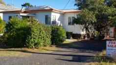  6 Jack Street Dalby QLD 4405 $160,000 Located a short walk to shops, pubs and clubs is this 2 bedroom home one street back from Drayton St in Jack St. Established gardens and attractive back yard with large areas of paving, lots of shady trees , rainwater tank with pump, a double garden shed, single lock up garage and covered carparking  Half a dozen solar panels on the roof, aluminium windows all round, fairly modern kitchen, gas stove, large dining area good sized air conditioned lounge, bathroom with shower bath, separate toilet. Bedrooms are well proportioned , one is split system air conditioned.  In general this house has been loved by its current owners who now have moved on leaving the opportunity for a retired couple or small family to live in a great street with great neighbours and just a short walk to facilities.  