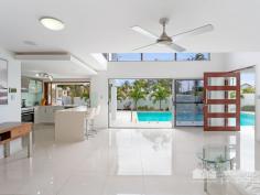  1 Landsborough Avenue, Scarborough -  Waterfront Properties Redcliffe Sleek and Stylish Family Home This modern stylish family home on a 405m2 block has been masterfully designed to make use of all available space. Feature packed this quality built home is supremely appointed and boasts the following: Expansive parents retreat with WIR, luxurious ensuite complete with twin shower, his and hers vanities and double spa bath, private balcony with water views 3 additional bedrooms with BIR  2 Living areas  Media room  Gourmet kitchen with servery to alfresco area + 6 burner gas stove, walk in pantry  Ultra modern main bathroom, ensuite, powder room  Good size laundry  Double lock-up garage + additional oversize garage perfect for the caravan or boat, enough room for all the toys  Relax in the resort style Magnesium pool with spa and waterfall features  Fantastic outdoor area for entertaining  Beautiful established gardens  Fully fenced with intercom at the gate  Solar power  Ceiling fans throughout  Walking distance to Scarborough Village and Southern Cross & Tech Colleges. No expense was spared when this impressive home was built. With too many features to possibly list, this is a must to inspect. Call Mark on 0413 447 576 to arrange an immediate inspection! 