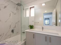  15 Wortley Road Greenmount WA 6056 $549,000 A 2018-built home surrounded by established gardens and landscaping puts you ahead of the game, ensuring you are ready to start your new life without having to bother about all of the usual ‘to-dos’ that come with a new build. This 4 bedroom, 2 bathroom Greenmount home delivers a chic, modern colour scheme, good sized bedrooms, an expansive parents’ retreat and a flexible floorplan. A below-ground pool, fully-fenced backyard and sizeable outdoor entertaining zone add the finishing touches to this stylish family home with a convenient foothills location. 4 Bedrooms 2 bathrooms 2018 rebuilt brick & iron Central open plan living Modern kitchen/meals Separate bedroom wings Spacious parents’ retreat Crisp chic colour scheme Poolside entertaining area Elevated 819 sqm block Foothills conv with views Set on the high side of the street with views of the Helena Valley this 4 bedroom, 2 bathroom home was rebuilt in 2018. A fresh, modern aesthetic, flexible floor plan and established gardens and landscaping combine to fashion a stylish home ready and waiting to begin life with a new family. A long verandah edged with lawn and garden draws you to the front door and into the open-plan kitchen/meals/family. Large picture windows make the most of the elevated position and valley outlook. A limited colour palette and easy-care finishes create a welcoming space that is both modern and practical. The kitchen features new appliances – a 900 mm oven, 5-burner hob and rangehood. Marble-look tops and white cabinetry with brass-look handles bring a cohesive style to the central island and benchtops. In the family room, a gas log fireplace creates a cosy focus while double doors open to the covered entertaining area and below ground pool – delivering seamless indoor-outdoor living. A gas bayonet and ducted evaporative cooling ensure year-round comfort. Double French doors lead from the family room to the spacious adults’ suite occupying one end of the home. A large bedroom with ample storage opens to a spacious lounge room and ensuite. Doors from the lounge area lead to the outdoor entertaining area, an arrangement that expands the indoor-outdoor living on offer. A central hallway with a timber dado leads to the 3-bedroom junior wing, family bathroom and laundry. New carpets Two of the junior rooms are fitted with mirrored built-in robes while a third has a walk-in robe, all boast new carpet. The neutral, limited colour scheme continues in the fully tiled family bathroom. The fully fenced backyard features a series of terraced lawn and garden centred around the below-ground salt pool. A gazebo and sizeable covered patio offer ample space for entertaining and relaxation. This home is turn-key ready with established gardens and landscaping, giving you the freedom to start enjoying your new home the moment you move in. Within easy reach of the local primary school, arterial road links and the outdoor adventures of the John Forrest National Park, this foothills property is ready and waiting. 