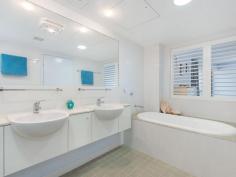  16 / 146 Prince Edward Parade, Scarborough -  Waterfront Properties Redcliffe Right on the Bay! There are just so many features to enjoy if you move into 'The Bay' complex at Scarborough - which is described by residents as a "Happy building". Not only is Unit 16 a very spacious (199m2) three bedroom apartment, but its design is practical and well thought out. With views that cannot be built out you will always be able to enjoy the gorgeous Bay outlook plus the delightful pretty night lights of both Redcliffe and all the way back to the Port of Brisbane. It's important for buyers to know that any new home built on the visible vacant block has a height restriction - the same level as the ones either side, so you will always have a water view. The very large Master bedroom opens up to the balcony facing the Queens Beach, so you can fall to sleep listening to the water lapping at the foreshore. Both ensuite and spare bathroom are bigger than most and the apartment has tons of storage cupboards throughout. Superbly located approximately halfway between Redcliffe and Scarborough, you can walk out the door and decide which way you fancy wandering off for your morning walk!  It's such a desirable lifestyle choice with happy residents who enjoy an living in an attractive, well-serviced building. The lovely foyer features a gorgeous pool, spa, gym and large common area.  Even the secure basement carpark is well-serviced, with a bathroom (ideal if you are downstairs in your garage area),a car wash station along with direct access to the beachfront via a tunnel walkway (meaning you can wheel a kayak or bikes from your garage through to the waterfront). Fully enclosed double garages are rare in unit complexes and this one is certainly bigger than average with plenty of storage room - perfect for those down-sizing from larger family homes who still want somewhere to 'potter or tinker'.  As there is no road in front of this unit, there is minimal (if any) traffic noise either! This lovely apartment is well worth an inspection, so it should definitely be on your list of apartments to view! This unit features: •	Spacious 199m2 of living  •	Three good-sized bedrooms  •	Study nook  •	Large bathrooms  •	Separate laundry  •	Two separate balconies  •	Water views from your kitchen, living area and front balcony  •	Plantation shutters throughout  •	Freshly re-painted internally  •	Access to pool, spa, gym roof-top  •	Great location with direct access to walking paths and the beach  •	Large double lock-up garage in secure basement carpark  •	NBN ready You need to make an appointment to view this apartment to appreciate all of the above, so call Karen Prince now on 0437 015 951 to arrange a time! 