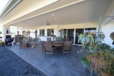  48-54 MARTIN PLACE TAMBORINE QLD 4270 $899,000.00 This amazing 4078 m2 Elevated property is in the Prestige "Riemore Downs" in one of best and ideal locations of Tamborine Village. This particular property boasts stunning views of Tamborine Mountain and the surrounding Ranges. This Architect Designed home was created by the current owners, who did not plan to leave so soon, as it is less than 12 months old.  Reluctant as they are, this will be to your benefit, as money was not spared in the making it literally a "Dream Home".  Loads of Bells and Whistles as you walk around the five bedrooms, all with built in robes, the master with walk-in and ensuite, the spacious well designed open plan kitchen, has stainless steel appliances with a 900mm Gas stove with Fan Forced oven, Stone bench tops and a very efficient walk in Butler's Pantry. The open plan living has thoughtfully set up three separate living areas, offering you a large family room and lounge that leads out to the Alfresco with a great entertainment and BBQ area.  Light and Airy with reverse Cycle Split Systems Air Conditioning as well as ceiling fans throughout the complete house. Back to the Grid 6klw Solar power keeps the bill very low.  Simple low maintenance design Landscape with a 16m x 9m Colourbond Shed, with plenty of room for a pool or a larger shed should you desire.  You will be impressed by this home and not disappointed.   Airconditioning, Broadband, Built In Robes, Courtyard, Dishwasher, Ducted Cooling, Ducted Heating, Ensuite, Fully Fenced, Grey Water System, Open Spaces, Outdoor Entertaining, Pay TV, Remote Garage, Rumpus Room, Secure Parking, Shed, Solar Hot Water, Solar Panels, Water Tank, Workshop, 
