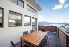  1/8 Skala Road  Tranmere TAS 7018 $400,000  Set across two levels providing sprawling views of the Derwent River, Hobart and the iconic Kunyanyi/Mt Wellington, this two bedroom Townhouse represents excellent buying in the Tranmere market. Featuring high cathedral ceilings and an open plan layout, the property benefits from an abundance of natural light and all day sun. The property also provides level off street parking for two vehicles and a neat and easy to maintain yard. Positioned close to the water, the Tranmere foreshore and walking track is less than 500 metres away and you are only 5 minutes drive to Shoreline Shopping Centre and Hotel, as well as multiple schools, parks and sporting grounds. 2 bed, 1 bath, OSP for 2 vehicles Water, city and mountain views All day sun, light filled rooms Walk to Tranmere foreshore, beaches Close to schools, bus routes, shops Reverse cycle a/c FEATURES: Air Conditioning Built-In Wardrobes Close To Schools Close To Shops Close To Transport Garden 