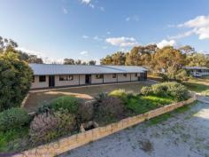  15 Wortley Road Greenmount WA 6056 $549,000 A 2018-built home surrounded by established gardens and landscaping puts you ahead of the game, ensuring you are ready to start your new life without having to bother about all of the usual ‘to-dos’ that come with a new build. This 4 bedroom, 2 bathroom Greenmount home delivers a chic, modern colour scheme, good sized bedrooms, an expansive parents’ retreat and a flexible floorplan. A below-ground pool, fully-fenced backyard and sizeable outdoor entertaining zone add the finishing touches to this stylish family home with a convenient foothills location. 4 Bedrooms 2 bathrooms 2018 rebuilt brick & iron Central open plan living Modern kitchen/meals Separate bedroom wings Spacious parents’ retreat Crisp chic colour scheme Poolside entertaining area Elevated 819 sqm block Foothills conv with views Set on the high side of the street with views of the Helena Valley this 4 bedroom, 2 bathroom home was rebuilt in 2018. A fresh, modern aesthetic, flexible floor plan and established gardens and landscaping combine to fashion a stylish home ready and waiting to begin life with a new family. A long verandah edged with lawn and garden draws you to the front door and into the open-plan kitchen/meals/family. Large picture windows make the most of the elevated position and valley outlook. A limited colour palette and easy-care finishes create a welcoming space that is both modern and practical. The kitchen features new appliances – a 900 mm oven, 5-burner hob and rangehood. Marble-look tops and white cabinetry with brass-look handles bring a cohesive style to the central island and benchtops. In the family room, a gas log fireplace creates a cosy focus while double doors open to the covered entertaining area and below ground pool – delivering seamless indoor-outdoor living. A gas bayonet and ducted evaporative cooling ensure year-round comfort. Double French doors lead from the family room to the spacious adults’ suite occupying one end of the home. A large bedroom with ample storage opens to a spacious lounge room and ensuite. Doors from the lounge area lead to the outdoor entertaining area, an arrangement that expands the indoor-outdoor living on offer. A central hallway with a timber dado leads to the 3-bedroom junior wing, family bathroom and laundry. New carpets Two of the junior rooms are fitted with mirrored built-in robes while a third has a walk-in robe, all boast new carpet. The neutral, limited colour scheme continues in the fully tiled family bathroom. The fully fenced backyard features a series of terraced lawn and garden centred around the below-ground salt pool. A gazebo and sizeable covered patio offer ample space for entertaining and relaxation. This home is turn-key ready with established gardens and landscaping, giving you the freedom to start enjoying your new home the moment you move in. Within easy reach of the local primary school, arterial road links and the outdoor adventures of the John Forrest National Park, this foothills property is ready and waiting. 