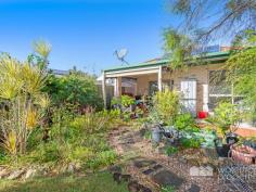  22 DONKIN STREET, Scarborough -  Waterfront Properties Redcliffe Perfect lowset home for Retirees - walk to the water! This wonderful property is all about enjoying a peaceful, easy Scarborough lifestyle. If you love the idea of living just a few metres to Scarborough's beautiful Queen's Beach, then this fabulous 3 bedroom lowset brick and tile home is a must-see. It is simply perfect for retirees who realise that apartment or retirement village living is just not for them!  In fact, this home would suit all types of buyers, as it's just a short walk to schools, public transport and Scarborough Village. You'll love being able to meander down to Scarborough Village to have coffee or lunch. If you are a walker or cyclist, you can access the gorgeous waterfront pathway just down the end of Donkin Street and wander off in either direction. This fabulous location simply ticks so many boxes! Don't let the street frontage deceive you - this home is actually very spacious, with two separate living areas, a dining room, three good-sized bedrooms, large bathroom and ensuite. The home is already discreetly set-up as a 'senior-friendly' residence with some hand rails, an open walk-in shower in the ensuite and a ramp at the front entrance. If you enjoy gardening but don't want a huge yard, then you'll appreciate this lovely private 418m2 block, which is lush with plants ready to be groomed and loved - just as the previous resident did prior to becoming unwell. With it's delightful north-facing patio, you'll find yourself sitting outside enjoying a cuppa even in the winter! Sleep in peace with the Master bedroom at the rear of the house where it is light, airy and just wonderfully cosy in this seasonal weather.  A fresh lick of paint would have this lovely home sparkling in no time! Come and see for yourself... With the market now buzzing again, don't delay your inspection or you might just miss out! 22 Donkin Street, Scarborough features: Three spacious bedrooms  Two generous living areas  Dining area  Good-sized kitchen  North-facing patio  Private 418m2 block  Double lock-up garage + extra off-street parking  Split system air-conditioners  Walk to Scarborough Village and waterfront  Senior-friendly home  Quiet sought-after location Call Karen Prince now on 0437 015 951 to arrange your inspection! 