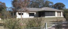 10A Tyrel St, Stanthorpe QLD 4380 $595,000 Here is the opportunity to enjoy this wonderful lifestyle on 4102m2 (one acre) of level spacious land in a natural semi bushland setting in a well recognised residential part of Stanthorpe - within a few minutes drive to the main street, schools etc or take and an easy enjoyable stroll along the parklands and walkways. The low set brick residence was built for its current owners in 2014 and is in absolute immaculate condition with full wall/ceiling insulation, fully screened (incl crimsafe), 2.7m high ceilings, laminated windows, ceiling fans and compliant smoke alarms. The open plan lounge/dining with ideal north/east aspect offers an easy flow of living space with natural light and warmed by a Nectre Mk2 wood heater. This area flows to a family/hobby room which can be closed off to offer extra separate family space. The well designed kitchen has caesar stone benchtops, 5 burner gas stove, electric oven, good size walk in pantry, double bowl sink and over head bench lighting. Casual entertaining is made extra easy and enjoyable with the adjoining fully screened sunroom/BBQ area. There are 4 bedrooms : the main has a full length wall of built ins, large ensuite with double basins, generous size shower and separate toilet. Two other bedrooms have built ins and the 4th could be used as a study. The family bathroom has sep bath, sep shower and sep toilet. The laundry is separate with direct rear access and the remote contolled garage has direct internal access and a full length wall of terrific storage cupboards. There are 2 x gas instantaneous hot water systems. Outside there is a choice of sheds! One is approx 7.5 W x 6.0 L x 2.7 H, insulated, power, lights, 1x15 amp point, 2 x10 amp points. The adjoining steel carport is approx 6.3 W x 9.00 L x 3.0 H (ideal for caravan), garden shed (4 x 3.1 x 2.5H) plus a wood shed - all have concrete floors. There is a Taylex treatment plant, 2 tanks (total 20,000 litres), a bore plus TOWN WATER. The property has an automatic watering system, is fully fenced with 1200mm sheep mesh and weldmesh plus a fenced area for vegies or small pets! 