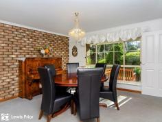  9 The Parkway Aberfoyle Park SA 5159  $535,000 This prestigious 4 bedroom family home has immediate street appeal. Sitting proudly on the high side exclusively in "The Parkway" location. Woodland Ridge Estate with its native wild life, leafy views and classic old gum trees has long been synonymous as bringing the country feel to the suburbs. Less than 5 minutes to the Hub Shopping Centre and the myriad of facilities on offer there. Real room to move here, boasting over 240m2 under the main roof. Comprised of formal and casual living plus opulent dining or entertaining under lofty raked ceilings adjacent a roaring brick feature fireplace. All 4 bedrooms are upstairs, the master with an ensuite, walk through robe plus built in robes and a ceiling fan. There are walk in robes to 2 of the other bedrooms and a 3 way main bathroom is ideal for growing families. Practical kitchen space with loads of storage - ideal for the gourmet chef, has been enhanced with an updated dishwasher, cook top and microwave oven. Heaps of family room in the open living and sliding door access to the rear outdoor entertaining area makes summer time BBQ's ideal. The terraced rear yard offers a small lawned area and leafy landscaped surrounds. Plenty of parking space, a generous double garage with rear roller door plus a "U" shaped driveway convenient for extra off street parking. This wonderful package overlooks the tranquil reserve across the road and provides the ideal home base to sit back, relax and enjoy. Lewis Prior First National Real Estate takes pride in presenting this property to the market. We welcome your enquiry and encourage you to make a personal appointment to inspect this property at a time that suits you. 