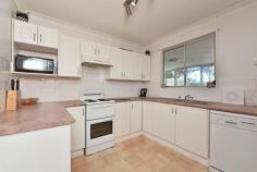  7 Asquith Avenue Windermere Park NSW 2264 $480,000 - $510,000 A leafy address plays host to this charming single-level home set on amongst well-tendered gardens and effortlessly blending its traditional cottage appeal with modern touches. With well-scaled proportions, a free-flowing layout and large picture windows catching pretty views, the home unites broad entertainer appeal with an inground pool being a terrific outdoor centre-piece. A flexible two-bedroom design with a large living space, generous sunroom and separate one-bedroom sleep-out off the garage provide every essential for complete comfort. – Stylish living room finished in mondern tones and warm timber flooring – Practical kitchen with good storage, electric cooker and dishwasher – Versatile sunroom framed by leafy views over the lengthy backyard – Outdoor appeal with alfresco areas, a naturally set pool and lovely gardens – Two bedrooms with robes, bathroom with separate shower and tub – One-bedroom sleep-out with air-conditioning and bathroom – Secure single garage with extra parking bays in the driveway – The beautiful inlet of Lake Petite is an easy stroll – just a block away – Boating, boat ramps, fishing and swimming all at your fingertips.. 